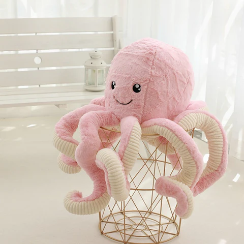 Peluche Pieuvre Géante Rose sur un support