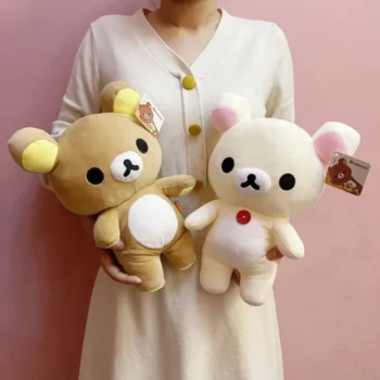 ours en peluche kawaii brun et blanc dans les mains