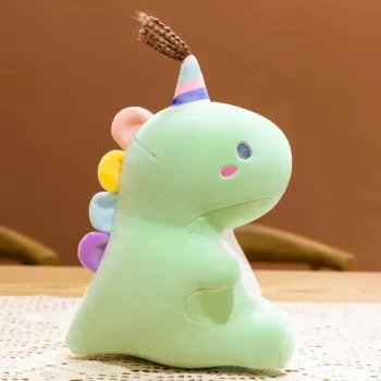 peluche dinosaure vert avec son chapeau de fête